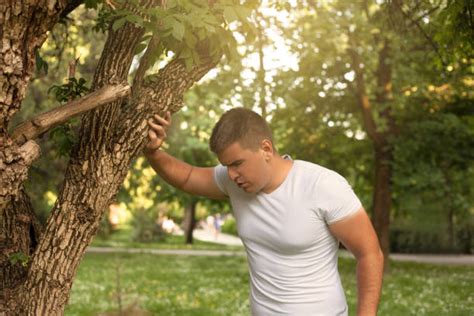 Best Man Leaning Against A Tree Stock Photos Pictures And Royalty Free