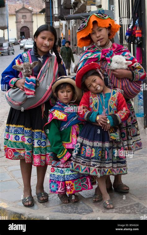 Four Peruvians Girls In Traditional Dress On The Streets Of Cusco Peru