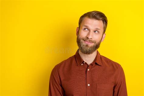 Photo Of Handsome Thoughtful Positive Man With Blond Beard Dressed Burgundy Shirt Look Empty