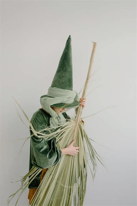 Child Wearing a Green Witch Costume · Free Stock Photo