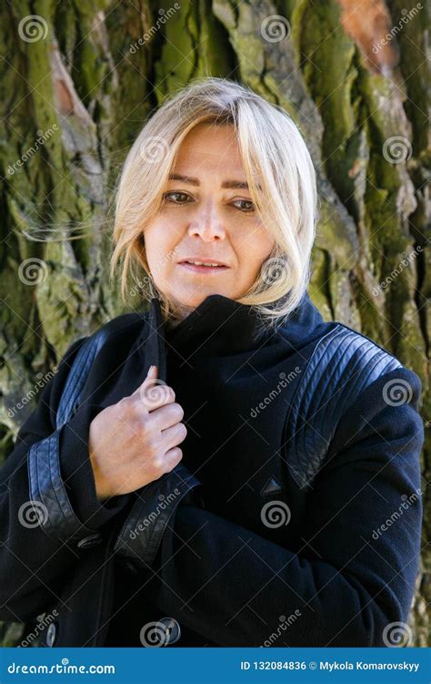 Woman Against Tree Trunk Stock Photo Image Of Blonde 132084836
