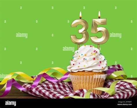 Birthday Cake With Candle Number 35 - On Green Background Stock Photo ...