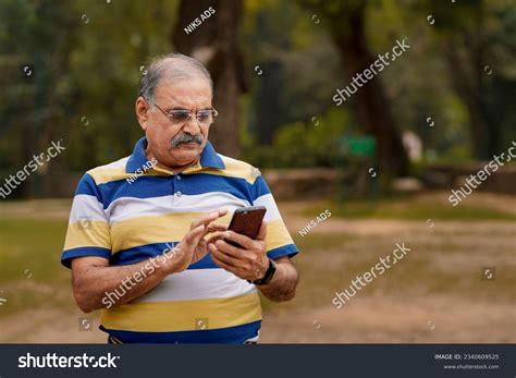 Old Indian Man Using Smartphone Park Stock Photo 2340609525 Shutterstock