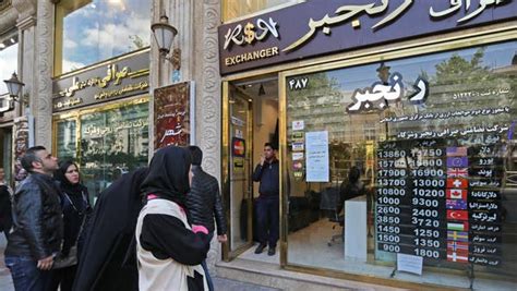 Iran’s currency hits new record low against the dollar, falling by 30 ...