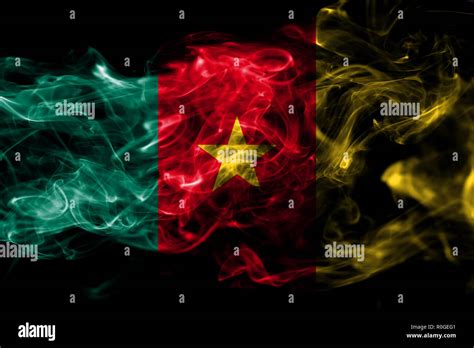 National Flag Of Cameroon Made From Colored Smoke Isolated On Black Background Abstract Silky