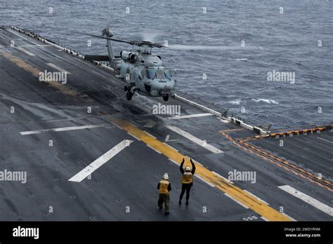 An Mh R Sea Hawk Helicopter Lands On The Flight Deck Of Uss Bonhomme