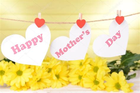 Happy Mothers Day Message Written On Paper Hearts With Flowers On