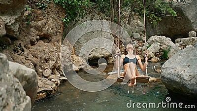Summer Vacations Of Bikini Beach Girl Model In Black Swimsuit On Palm Tree Swing Over Mountain
