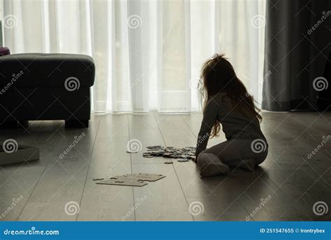 Little Girl is Putting Puzzles on the Floor in the Living Room Stock Image - Image of children ...