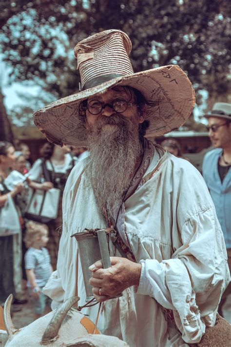 Man with Gray Beard Posing in Hat · Free Stock Photo