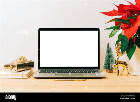 Laptop With Mockup Blank Screen On Wooden Table With Christmas Gift