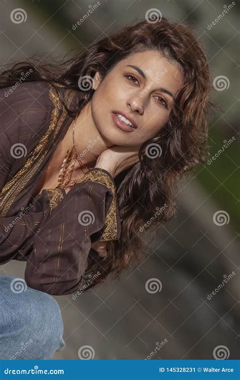 A Lovely Brunette Model Posing Outdoors With The Latest Fashions Stock Image Image Of