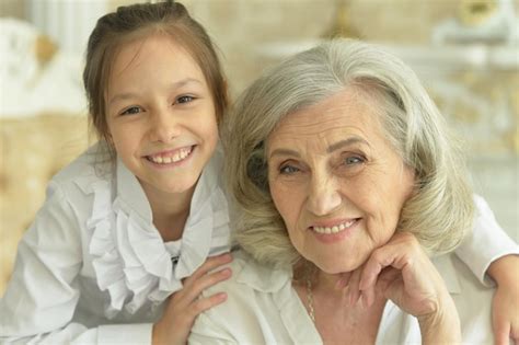 Premium Photo Portrait Of A Happy Grandmother And Granddaughter