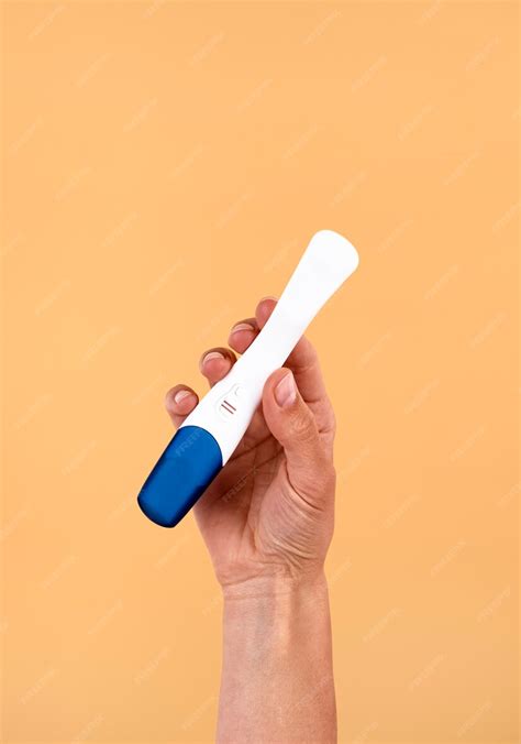 Free Photo Hand Holding Positive Pregnancy Test