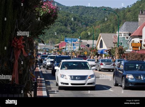 The Traffic On The Road With Cars The People In The Main Street