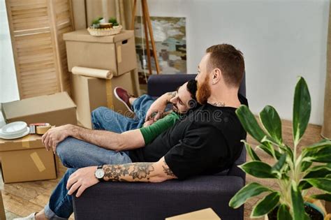 A Gay Couple Sits On A Stock Photo Image Of Intimate