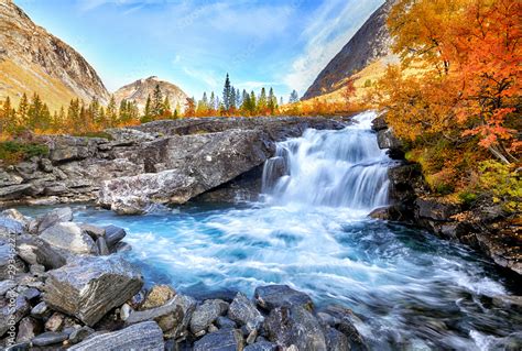 Beautiful autumn landscape with yellow trees and waterfall Stock Photo ...