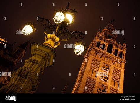 illuminated tower of La Giralda Cathedral at night in Sevilla Andalucia ...