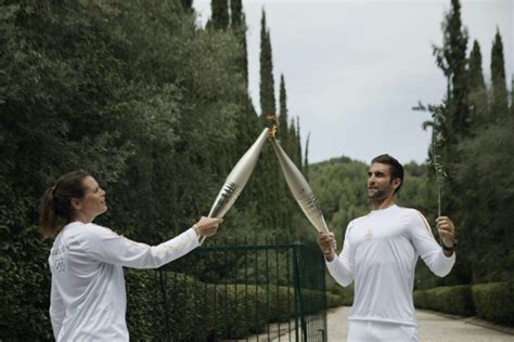 Paris Torch Lit In Ancient Olympia Olympic Relay Under Way