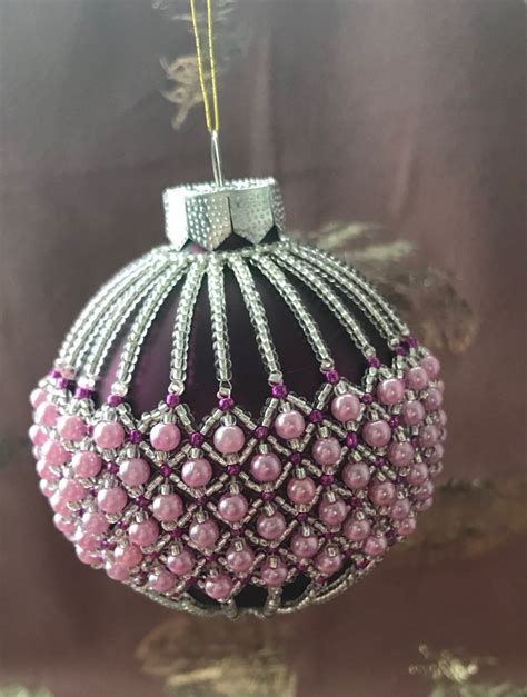 A Pink Ornament Hanging From A Tree