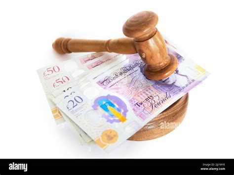 Gavel with british pound notes Stock Photo - Alamy