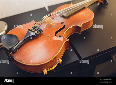 The Violin On The Dark Table Close Up Of Violin On The Wooden Floor