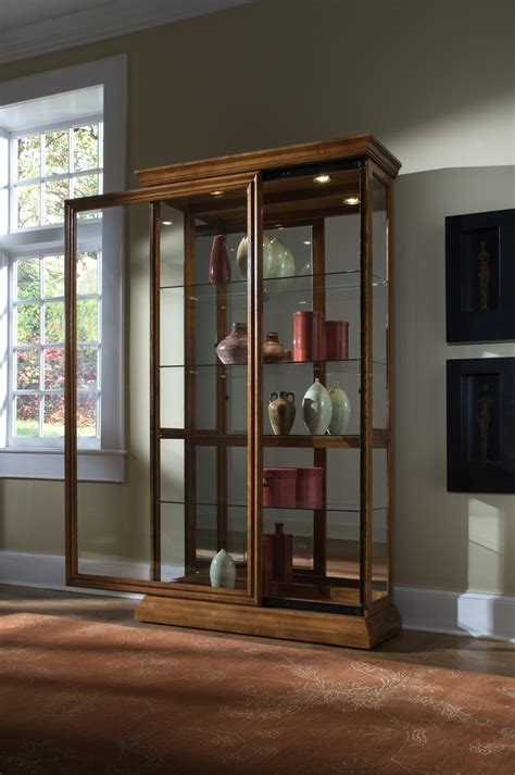 Lighted Sliding Door 4 Shelf Curio Cabinet In Golden Oak Brown 20544 By Pulaski At Millerhome