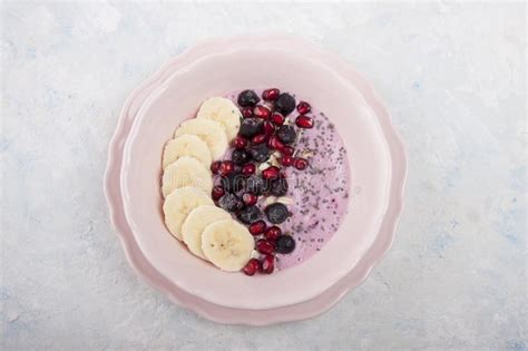 Smoothie Bowl With Banana Blackcurrant Pomegranate Seeds Oatmeal And