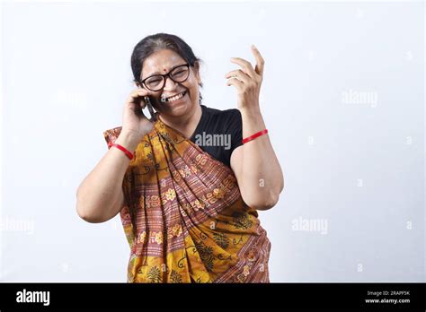 Rural Indian old woman wearing saree portraying various expressions on ...