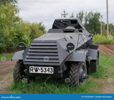 German Armoured Personnel Carrier Of World War Ii In Black Camouflage On A Leafy Background