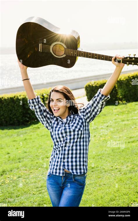 Beautiful Brunette Playing Acoustic Guitar Hi Res Stock Photography And Images Alamy