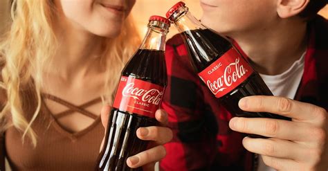 Woman Holding Coca Cola Bottle · Free Stock Photo