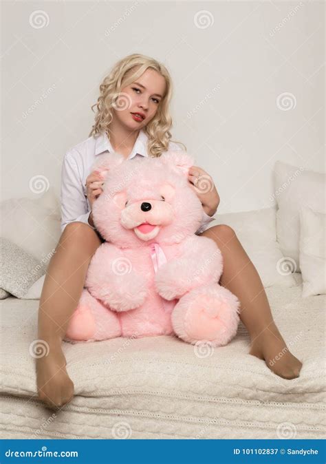 Happy Beautiful Blonde Woman Hugging A Teddy Bear Concept Of Holiday Or Birthday Stock Image