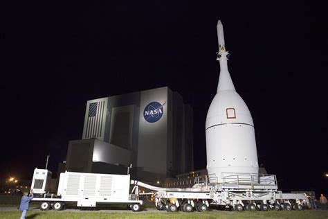 NASA’s Pathfinding Orion Rolls to Launch Pad, Hoisted atop Rocket for ...