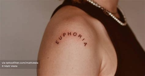 Word Euphoria Tattooed On The Shoulder