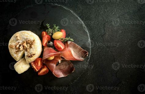 Served food on black background 23303223 Stock Photo at Vecteezy