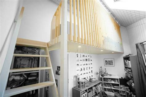 There Is A Loft With Stairs And Shelves In The Room That Has Various