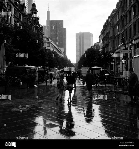 People Walking On Street In Rain Stock Photo - Alamy