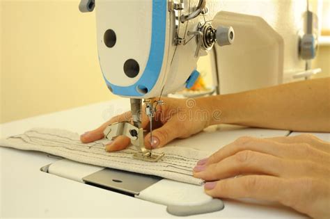 Seamstress Hands Sew On A Sewing Machine Parts Of Sewing Machine