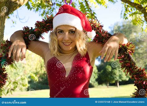 Fat Blonde Woman And Aerial Hoop Sportswoman Dressed As Father Christmas Doing Different