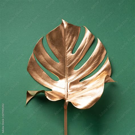 Golden Tropical Monstera Leaf On Nude Background With Copy Space Top View Flat Lay Creative