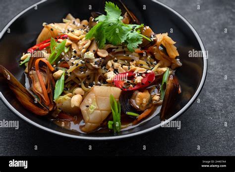 Pasta With Seafood Mussels Squid Herbs Sesame Seeds And Nuts Stock