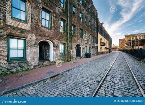 The Cobblestone River Street And Old Buildings In Savannah Georgia