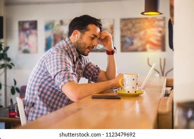 Upset Afroamerican Male Eating Spaghetti On Stock Photo