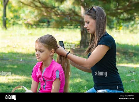 girl combing hair girl stock photo alamy