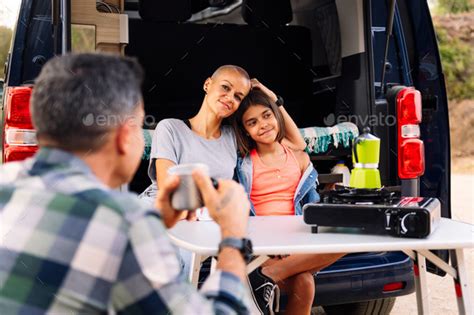 family camping in with their camper van Stock Photo by Raul_Mellado