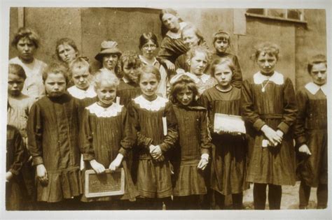 Anna Holman Standing Outdoors With A Group Of French School Girls