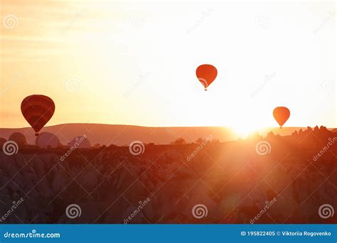 Silhoutte Of Balloon On Sunrise. Famous Hot Air Balloon Flying Over ...