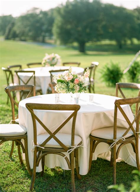 Neutral Dining Table With Wooden Cross Back Chairs Flowers Ward