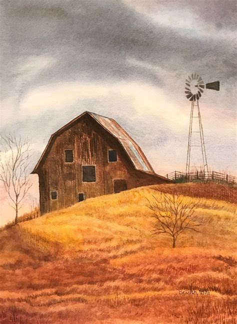 An Outdoor Scene That Captures The Beauty Of A Red Barn And Windmill